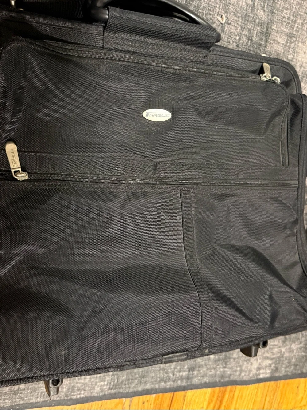 Targus rolling laptop case featuring a prominent oval brand logo